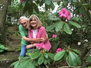 L.G. "Spike" Walters and his wife Kay pose with a beautiful rhododrndron in their Butler garden.