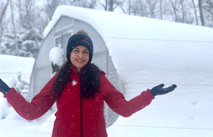 Niki Jabbour is an expert at growing plants year round even in Nova Scotia. She's seen here in front of her poly tunnel during a Canadian snow storm.